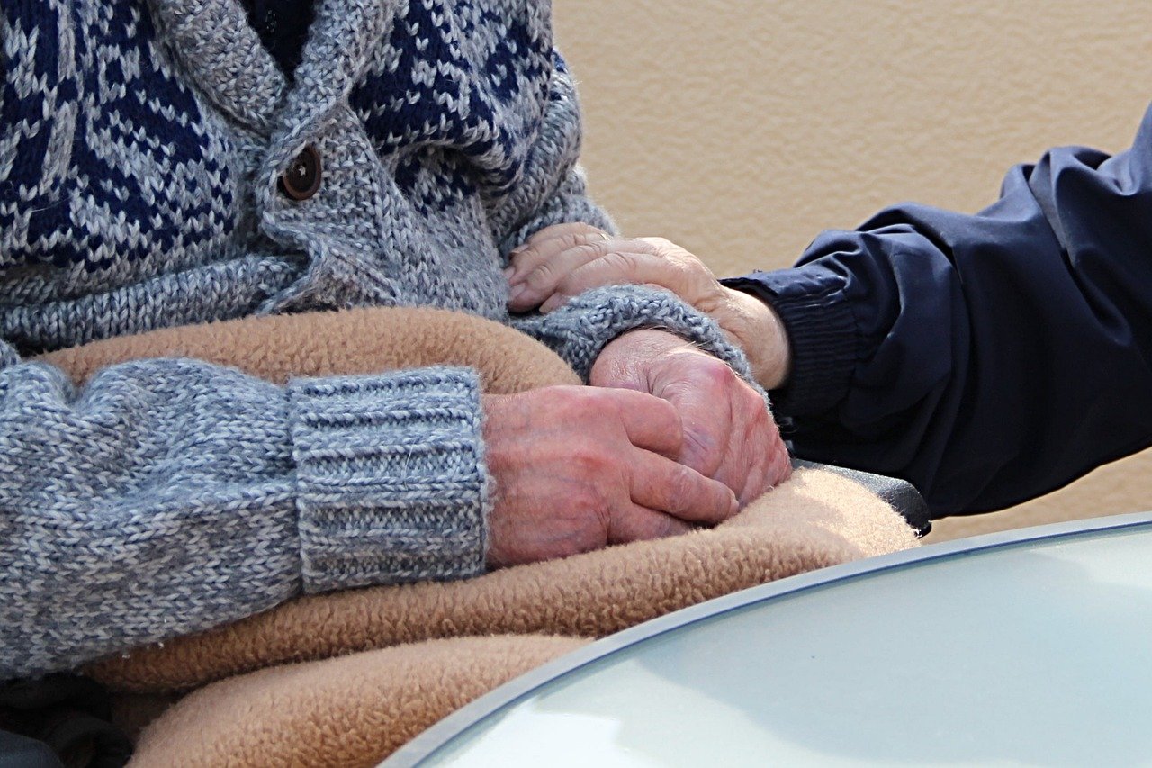 senior citizen with caregiver