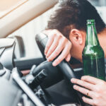 drunk driver at wheel