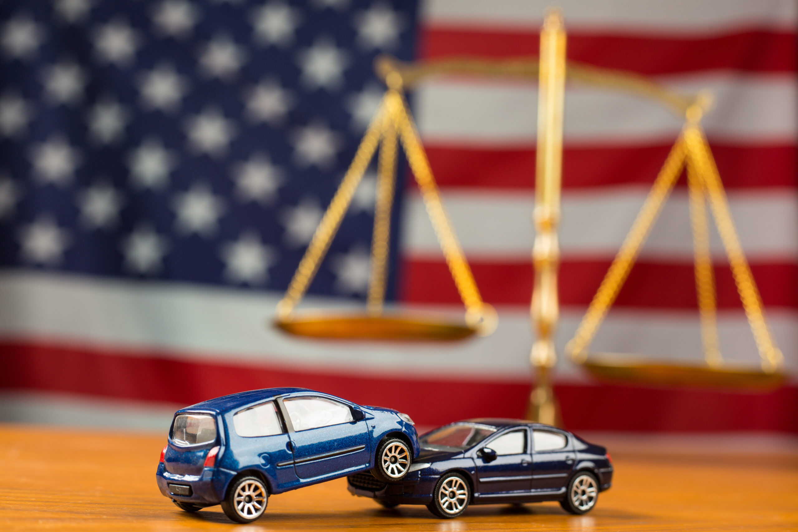 two cars on attorney's desk